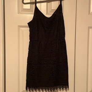 Like new black lace mini dress with adjustable straps!